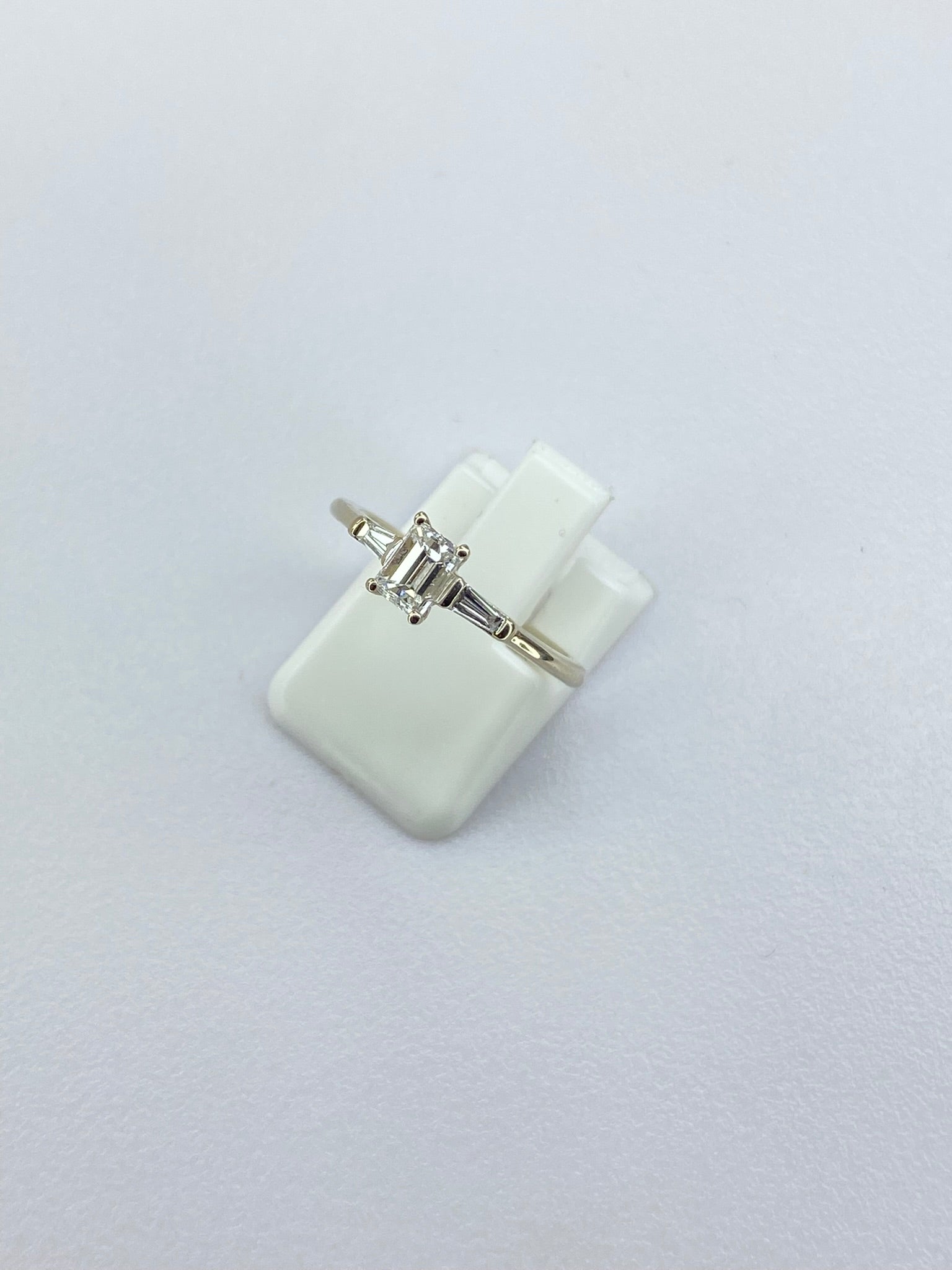 0.45ct Emerald Cut Diamond Three Stone Ring – 18KT Gold