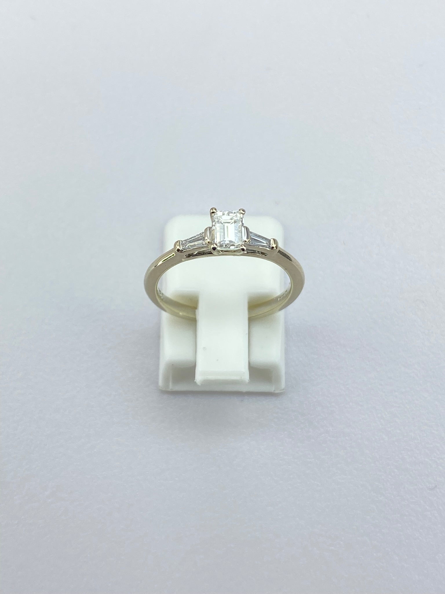 0.45ct Emerald Cut Diamond Three Stone Ring – 18KT Gold