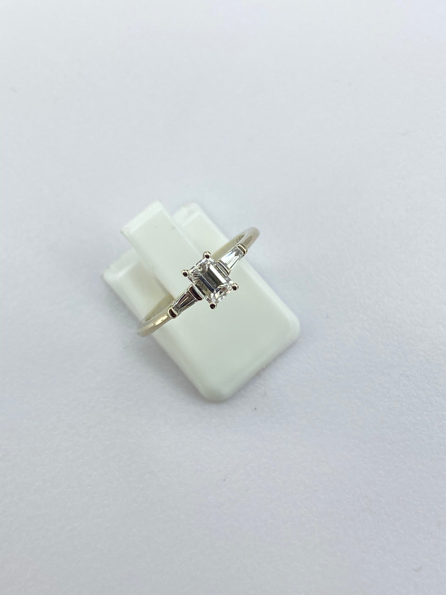 0.45ct Emerald Cut Diamond Three Stone Ring – 18KT Gold