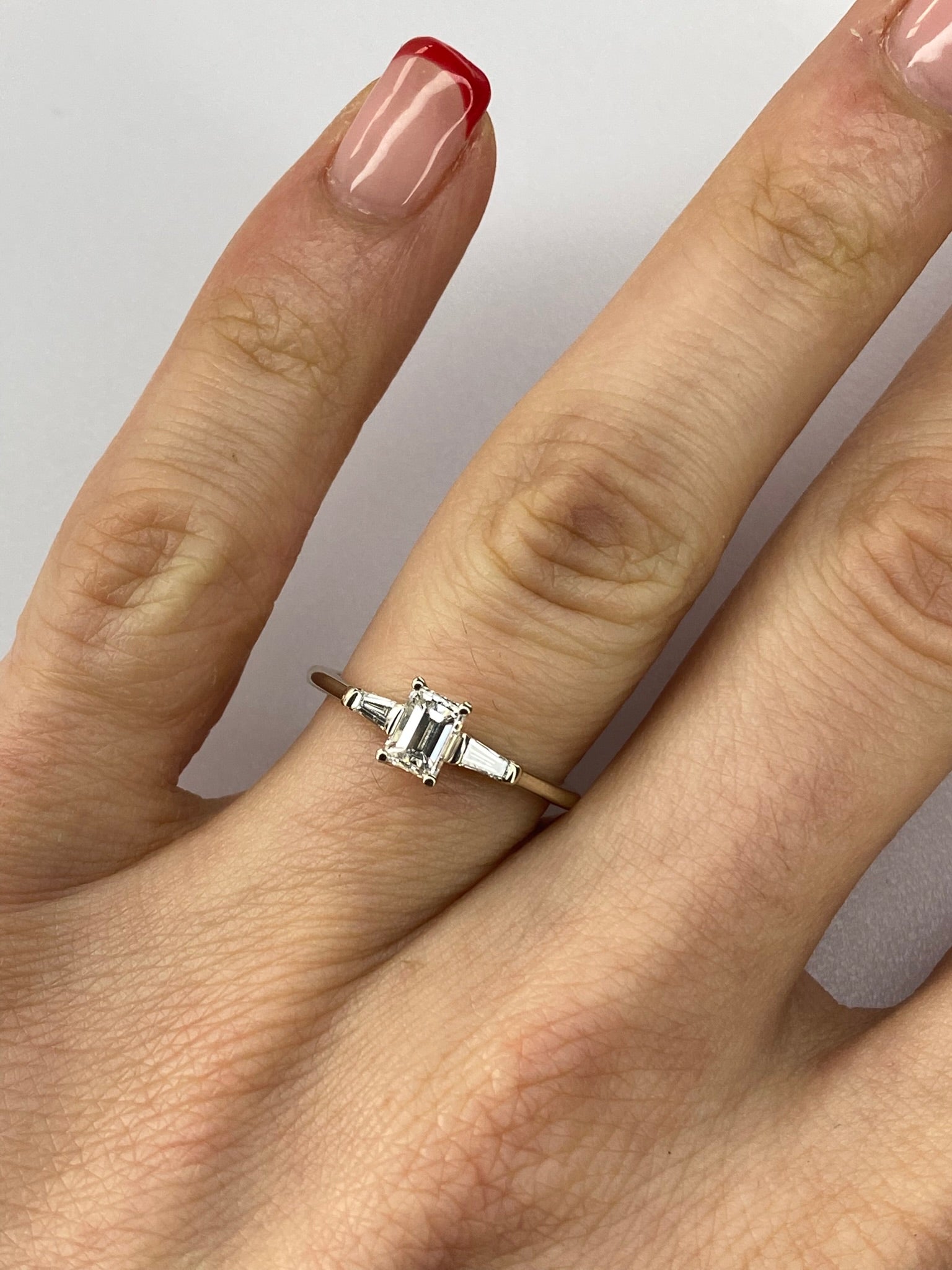 0.45ct Emerald Cut Diamond Three Stone Ring – 18KT Gold