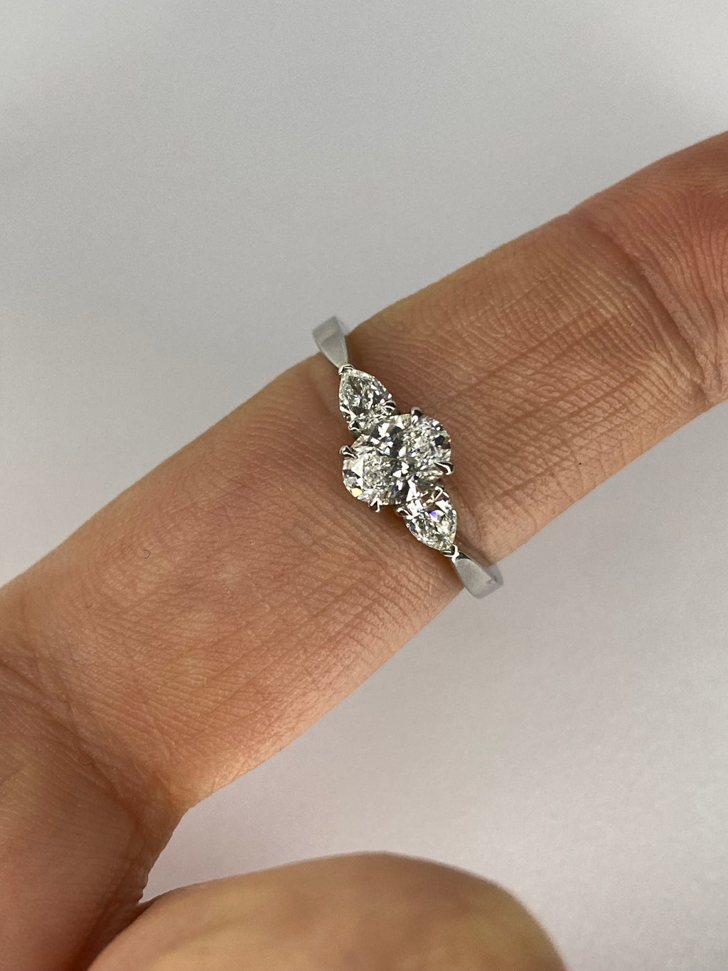 Oval Diamond & Pear Trilogy Ring in Platinum – 0.95ct Total Diamond Weight