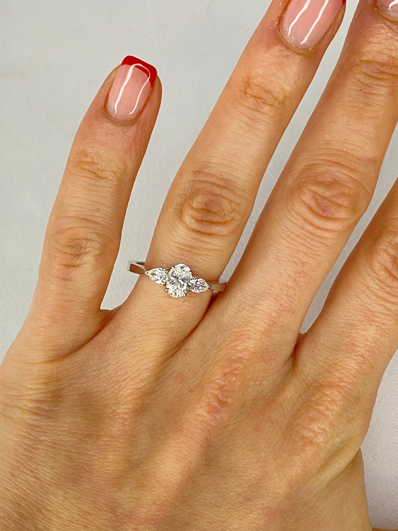 Oval Diamond & Pear Trilogy Ring in Platinum – 0.95ct Total Diamond Weight